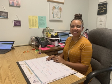 Miss Peabody at her desk 