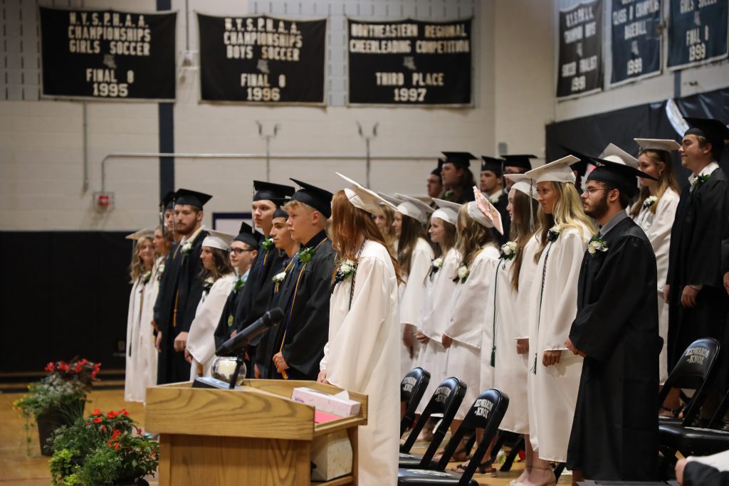 Line of students awaiting to graduate in their gowns.