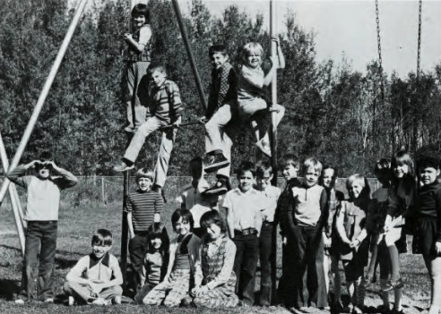 black and white image of students on the playground during the 1974-75 school year