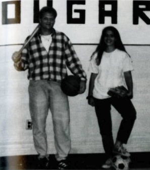 black and white image of two students wearing baseball/softball gloves during the 1994-95 school year