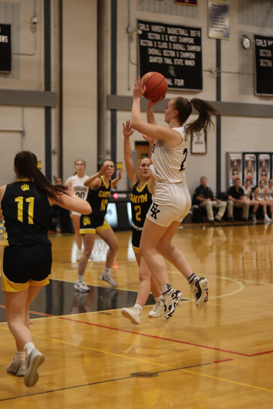students playing basketball
